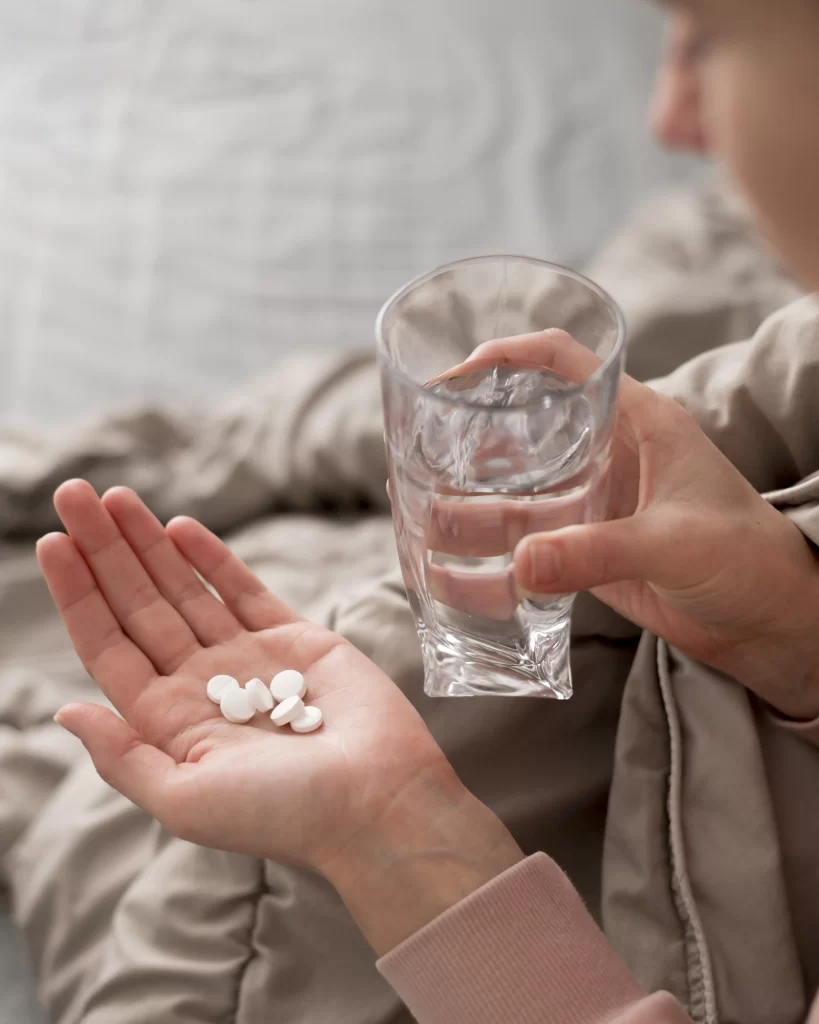 high-view-woman-having-pills-her-hand