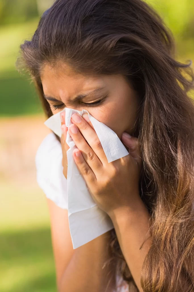 woman-blowing-nose-with-tissue-paper