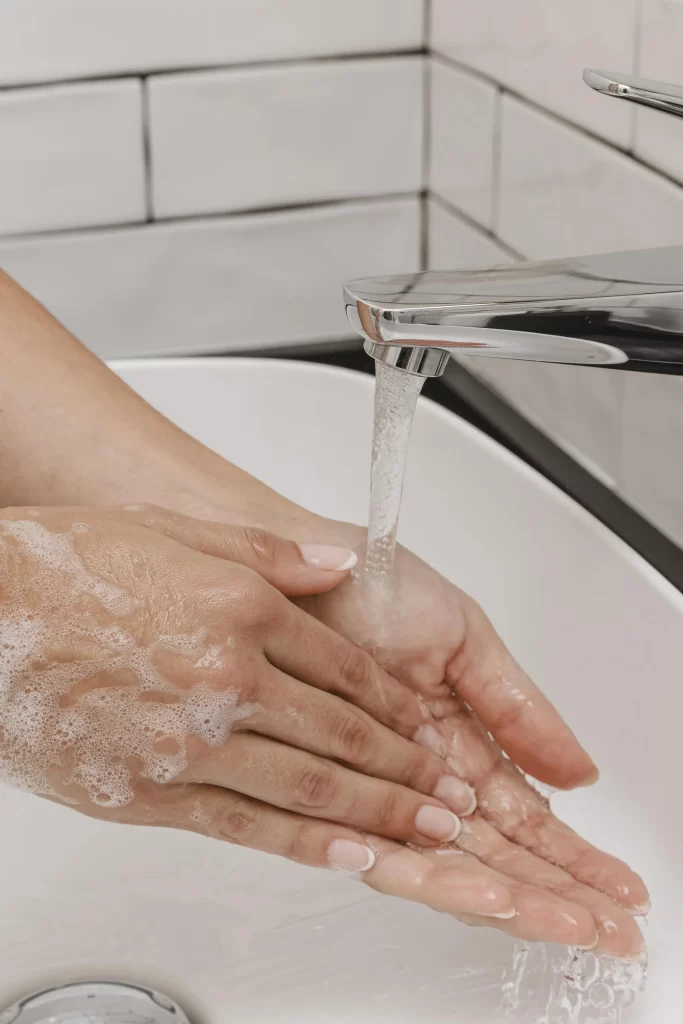 washing-hands-rubbing-with-soap-running-water